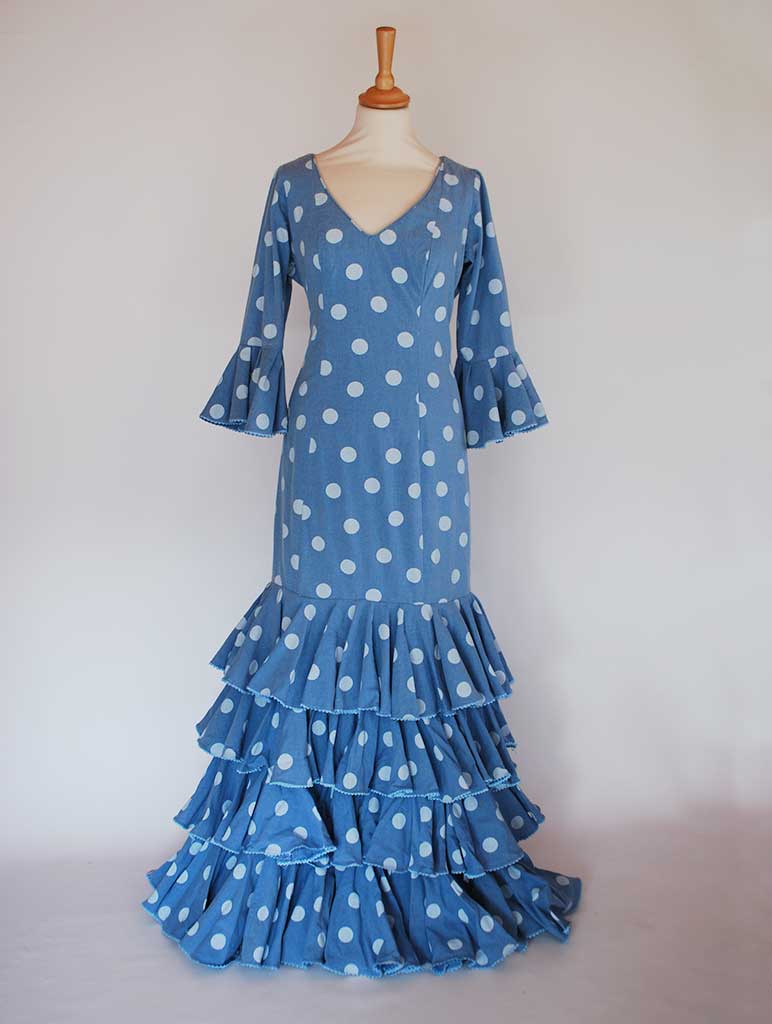 Tradicional flamenco dress. Blue with dots. Feria de Abril. Sevilla Spain