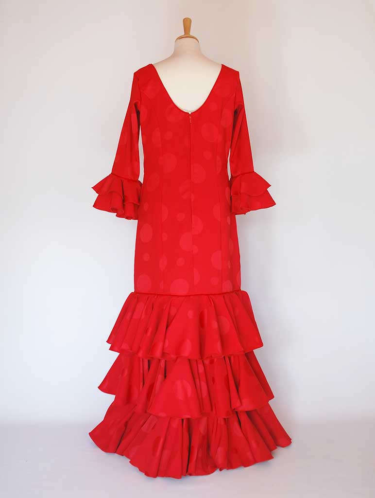 Traditional spanish dress. Red, flills dots. Flamenco. Feria Sevilla